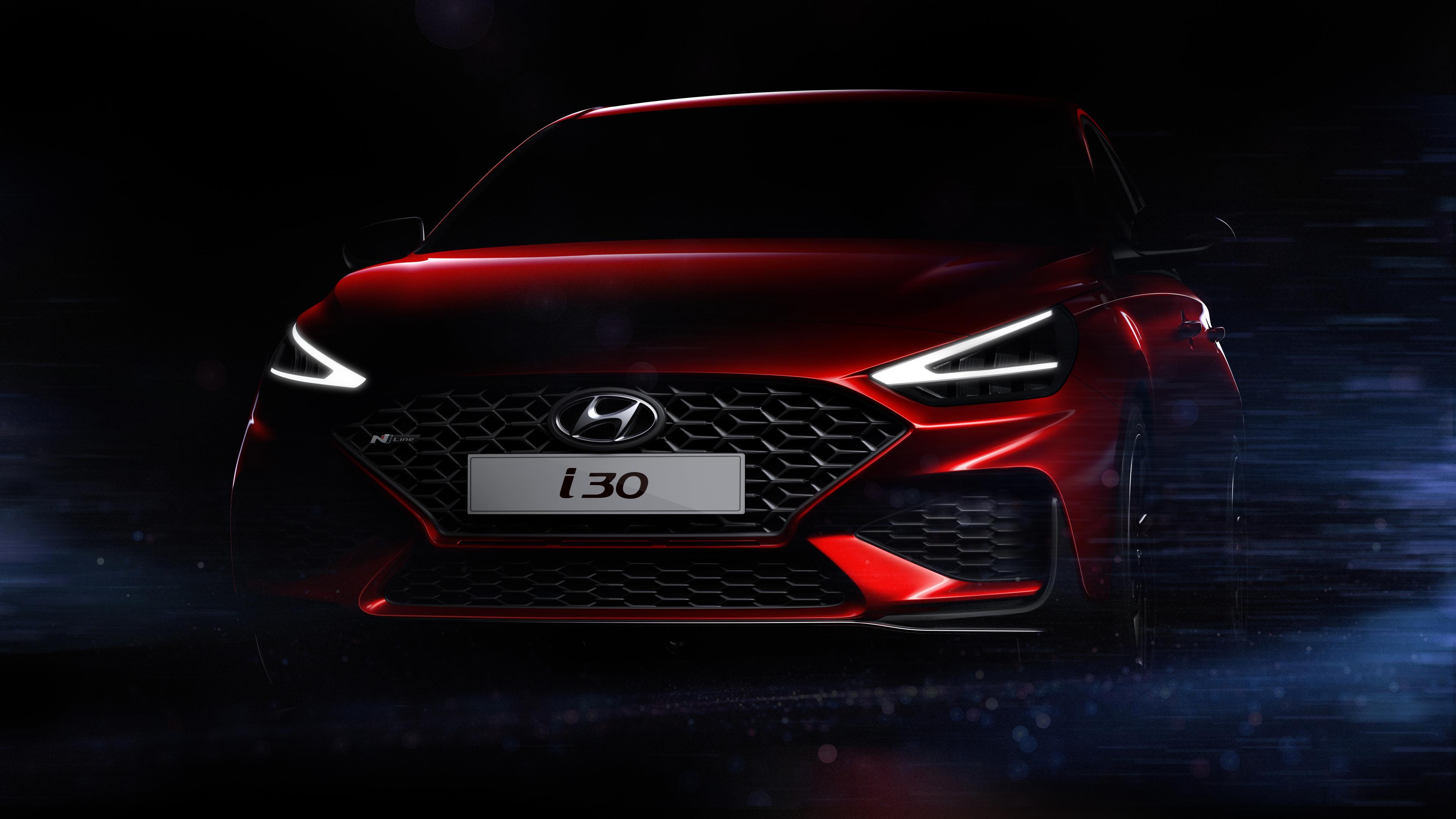 Teaser mostra a frente do novo Hyundai i30 vermelho com grade em forma de losango deitado e faróis em forma de V