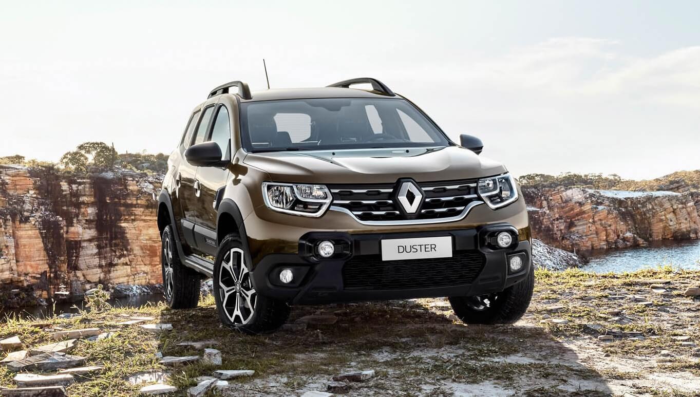 Novo Renault Duster na cor marrom em cima de um penhasco com cãnions ao fundo